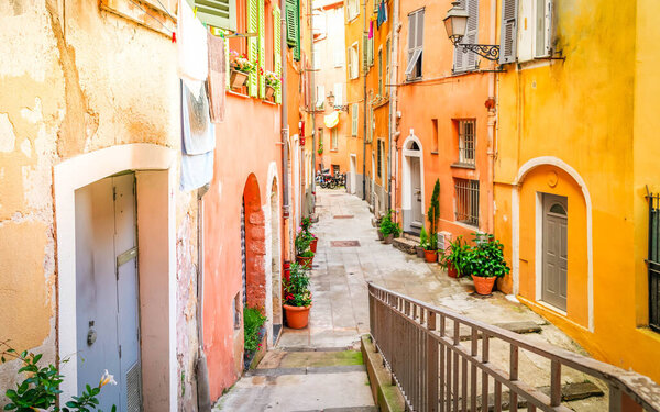 Cosy street in old town of Nice, France, toned