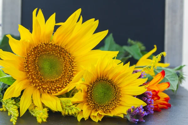 Fall sunflowers with pumpkin — Stock Photo, Image