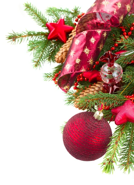 Fir tree with red christmas decorations and cones — Stock Photo, Image