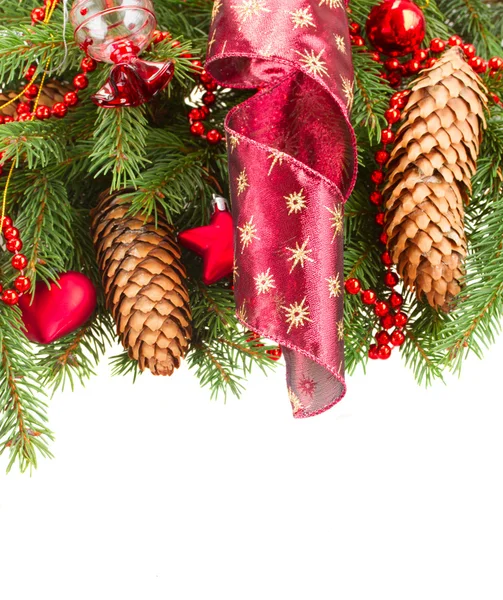 Fir tree with red christmas decorations and cones Royalty Free Stock Photos