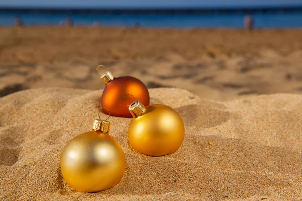 Christmas balls  on beach — Stock Photo, Image