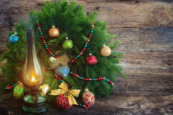 Vintage lantern with christmas wreath — Stock Photo, Image