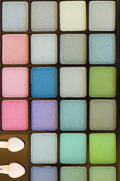 Brushes on eye shadows palette — Stock Photo, Image