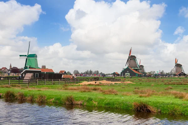 Dutch windmills over  river — Stock Photo, Image