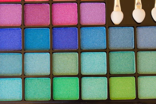 Brushes on eye shadows palette — Stock Photo, Image