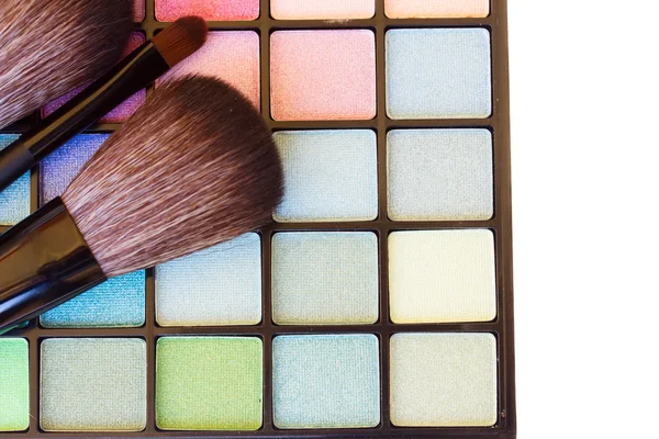 Brushes on eye shadows palette — Stock Photo, Image