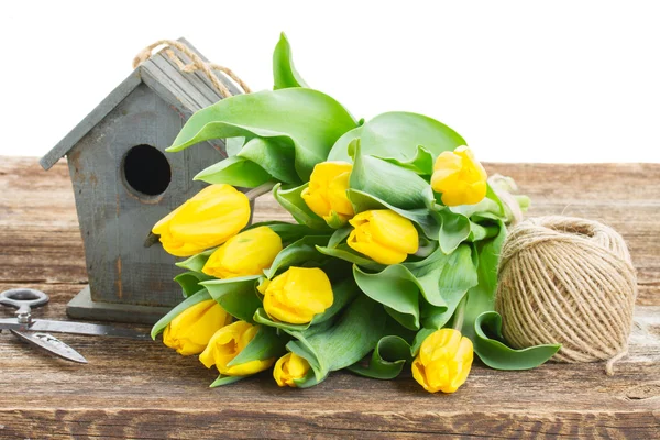 Yellow tulips  with birdcage — Stock Photo, Image