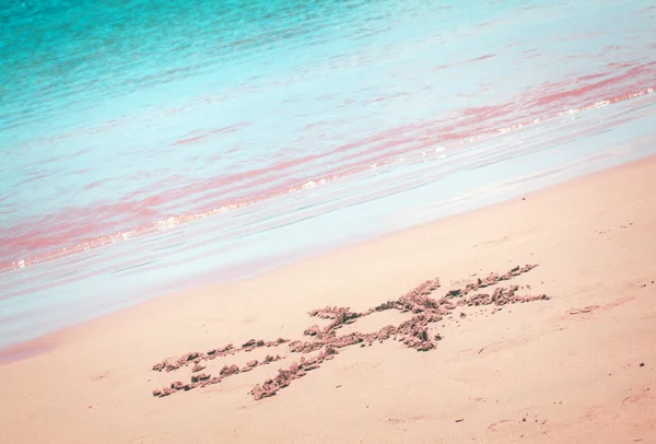 Sun drawn on sandy beach — Stock Photo, Image