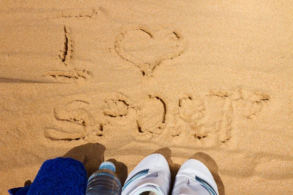 Signe J'aime le sport dans le sable — Photo