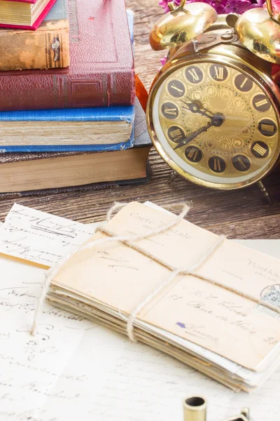 Antique  clock with pile of mail — Stock Photo, Image