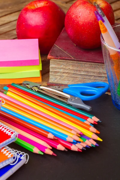 Set of colorful pencils on black board — Stock Photo, Image