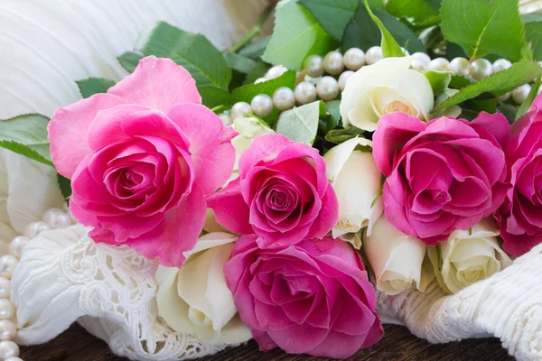 Pink and orange roses with lace — Stock Photo, Image