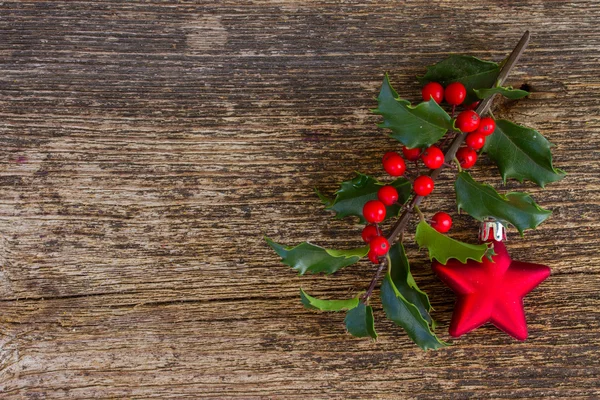 Holly branch with christmas decorations — Stock Photo, Image