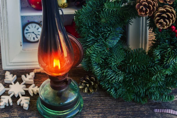 Vintage lantern with christmas wreath — Stock Photo, Image