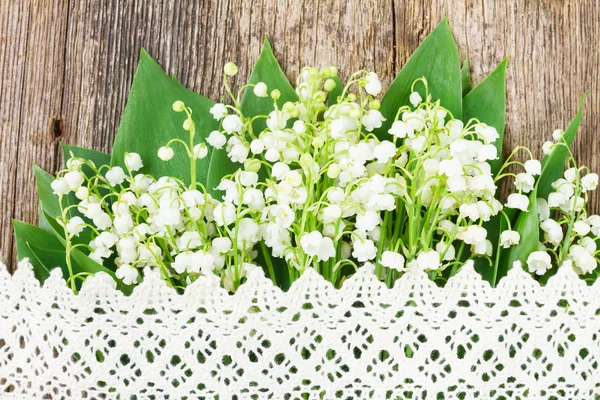 Lilly of valley on wood — Stock Photo, Image