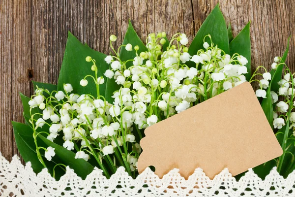 Lilly of valley on wood — Stock Photo, Image