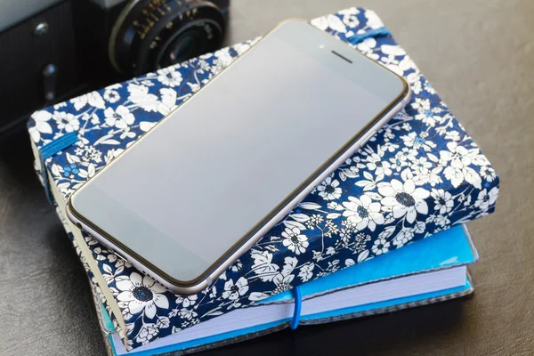 Phone and notebooks — Stock Photo, Image