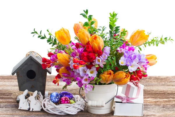 Spring flowers with easter eggs — Stock Photo, Image