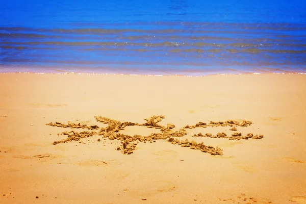 Солнце на песчаном пляже — стоковое фото