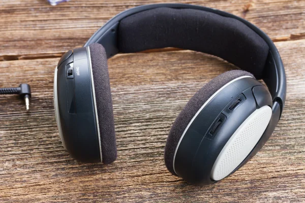 Headphones on wood — Stock Photo, Image