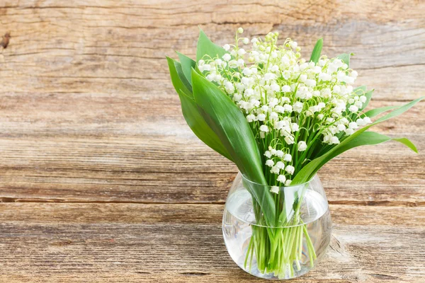 Lilly of valley on wood — Stock Photo, Image