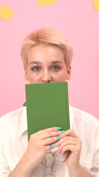 Close Girl Bright Makeup She Hides Book Looks Scene Pink — Stock Video