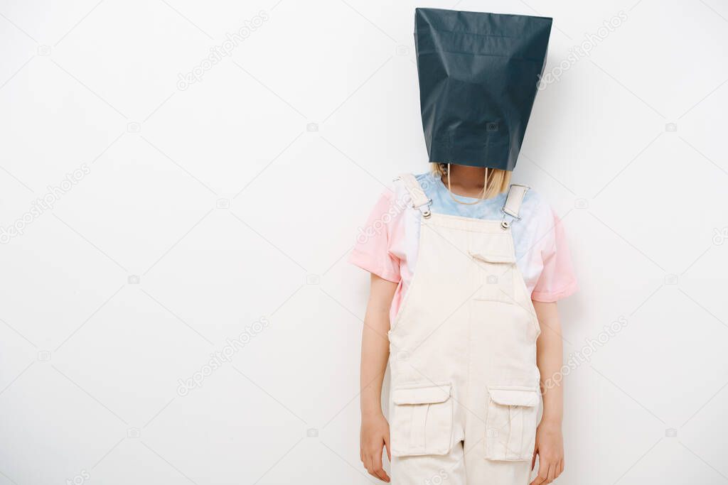 Young girl hid from the problems by putting a bag over her head and was offended