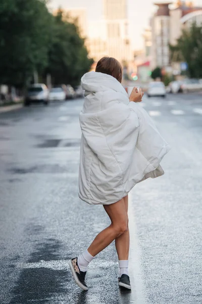 Woman Bare Legs Wrapped Blanket Walking Empty Wet City Road — Stock Photo, Image