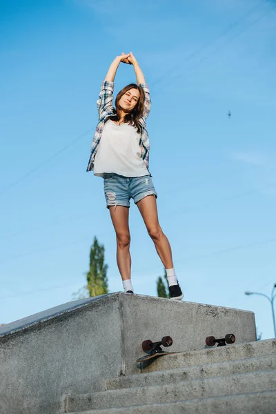 Cheeky Woman Stretching While Standing Concrete Parapet She Wearing Checkered — Stock Photo, Image