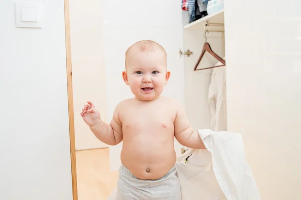 Little child trying on clothes — Stock Photo, Image