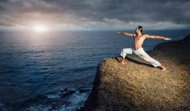 Yoga near the ocean clipart