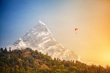 Paragliding in Himalaya clipart
