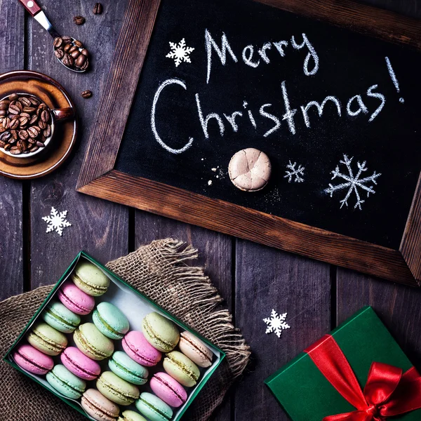 Colorful macarons and coffee on Christmas — Stock Photo, Image