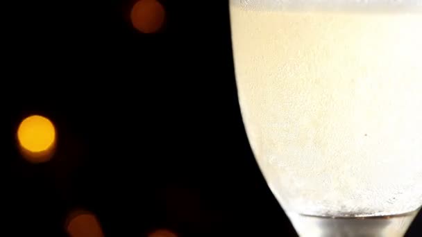 Glass of champagne on a black background — Stock Video