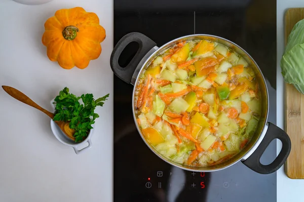 Cooking Bright Vegetable Soup on the Stove