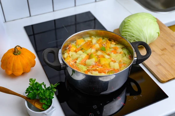 Cooking Bright Vegetable Soup on the Stove