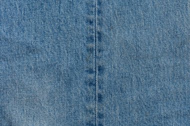 Kot pantolon arka planı kapatır. Denim dikişleri