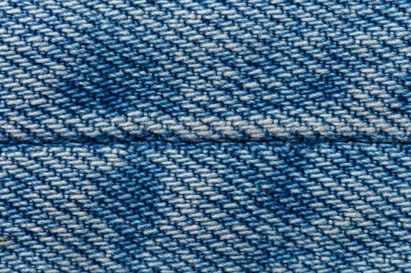 Jeans sluiten de achtergrond. Stikken van denim — Stockfoto