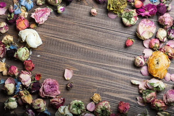 Dried roses on wood. Valentines background. — Stock Photo, Image