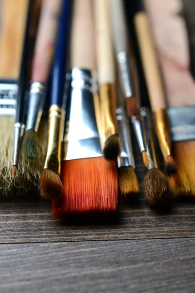 Brushes on wood background — Stock Photo, Image