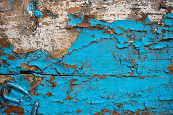 Old wooden surface covered with several layers of paint — Stock Photo, Image