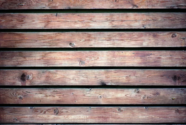 Old wooden surface covered with several layers of paint — Stock Photo, Image