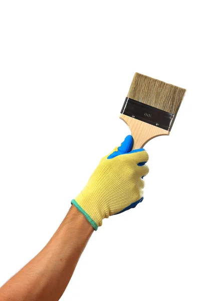 Mão em uma luva está segurando um pincel isolado no fundo branco — Fotografia de Stock