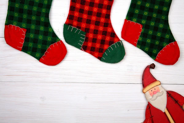 Christmas card. Christmas stocking and Santa Claus — Stock Photo, Image