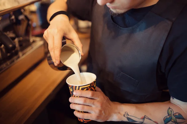 Barista at work in a coffee shop — Stock Photo, Image