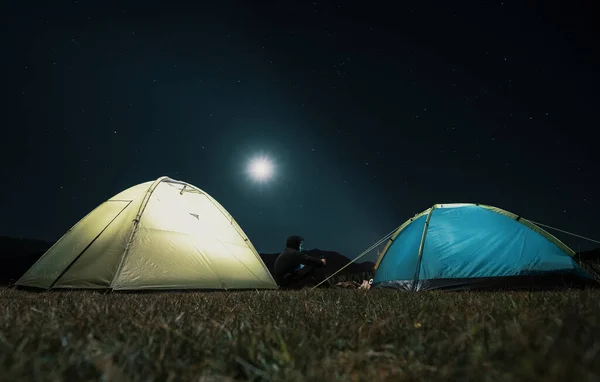 Tourist tents in camp among meadow in the night mountains — Stock Photo, Image