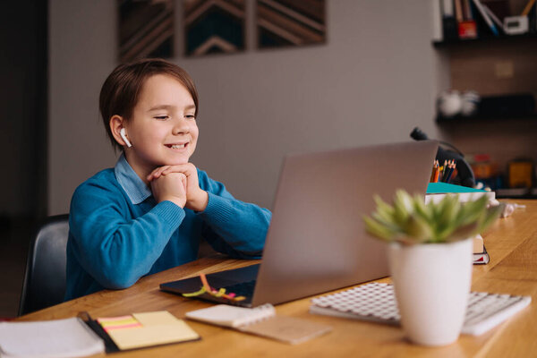 Online learning, boy using laptop for his classes