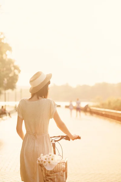 Girl with her bicycle — Stock Photo, Image