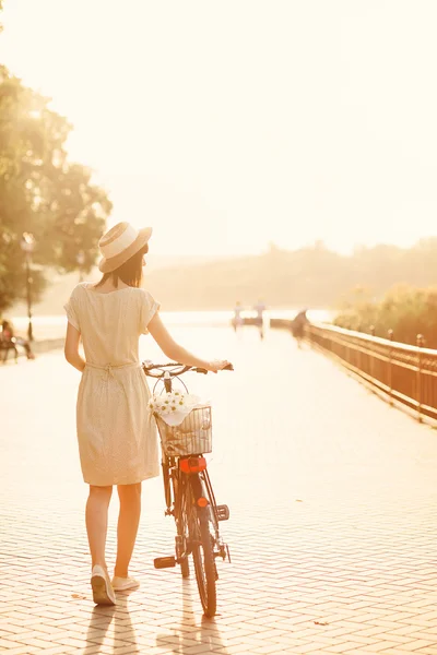 Girl with her bicycle — Stock Photo, Image