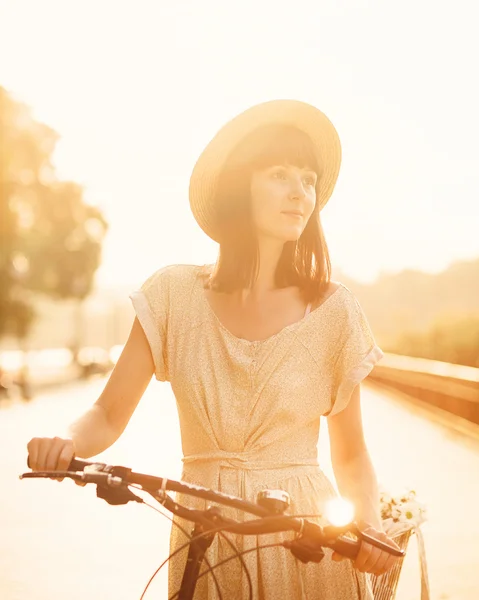 Girl with her bicycle — Stock Photo, Image